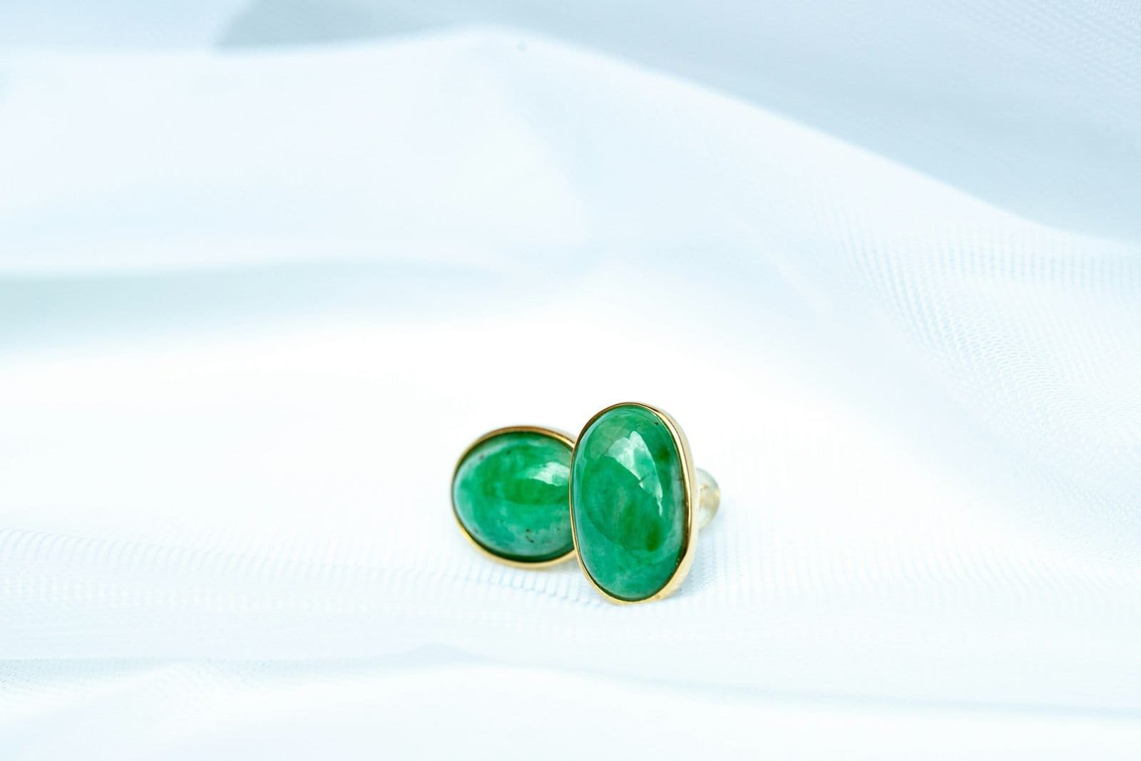 a pair of green and black dice
